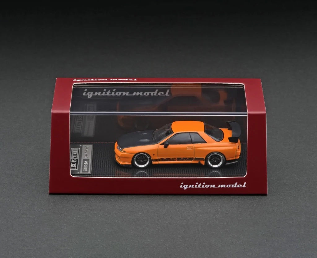 Side view of Top Secret GT-R (VR32) Yellow Orange Metallic 1:64 scale model car by Ignition model