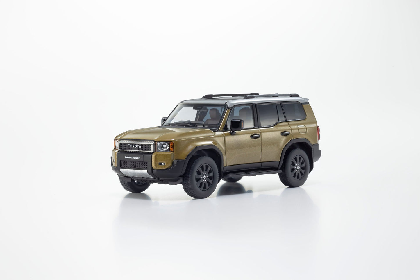 Front perspective of Toyota land cruiser 250 ZX First edition Sand/Light Gray 1:43 scale model car - Kyosho