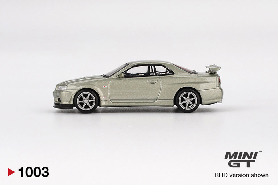 Side view of Nissan Skyline GT-R (R34) V-Spec II Nür Millenium Jade 1:64 scale model car - Mini GT