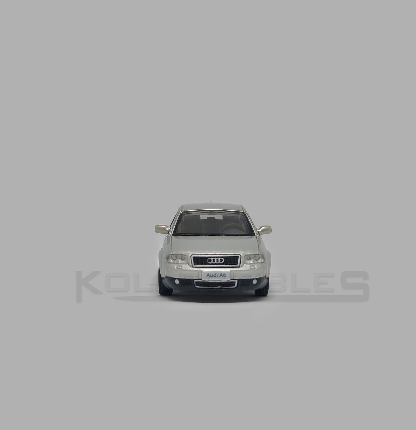 Front view of Audi A6 second generation (C5) metallic silver 1:64 scale model car - Xcartoys x Poprace
