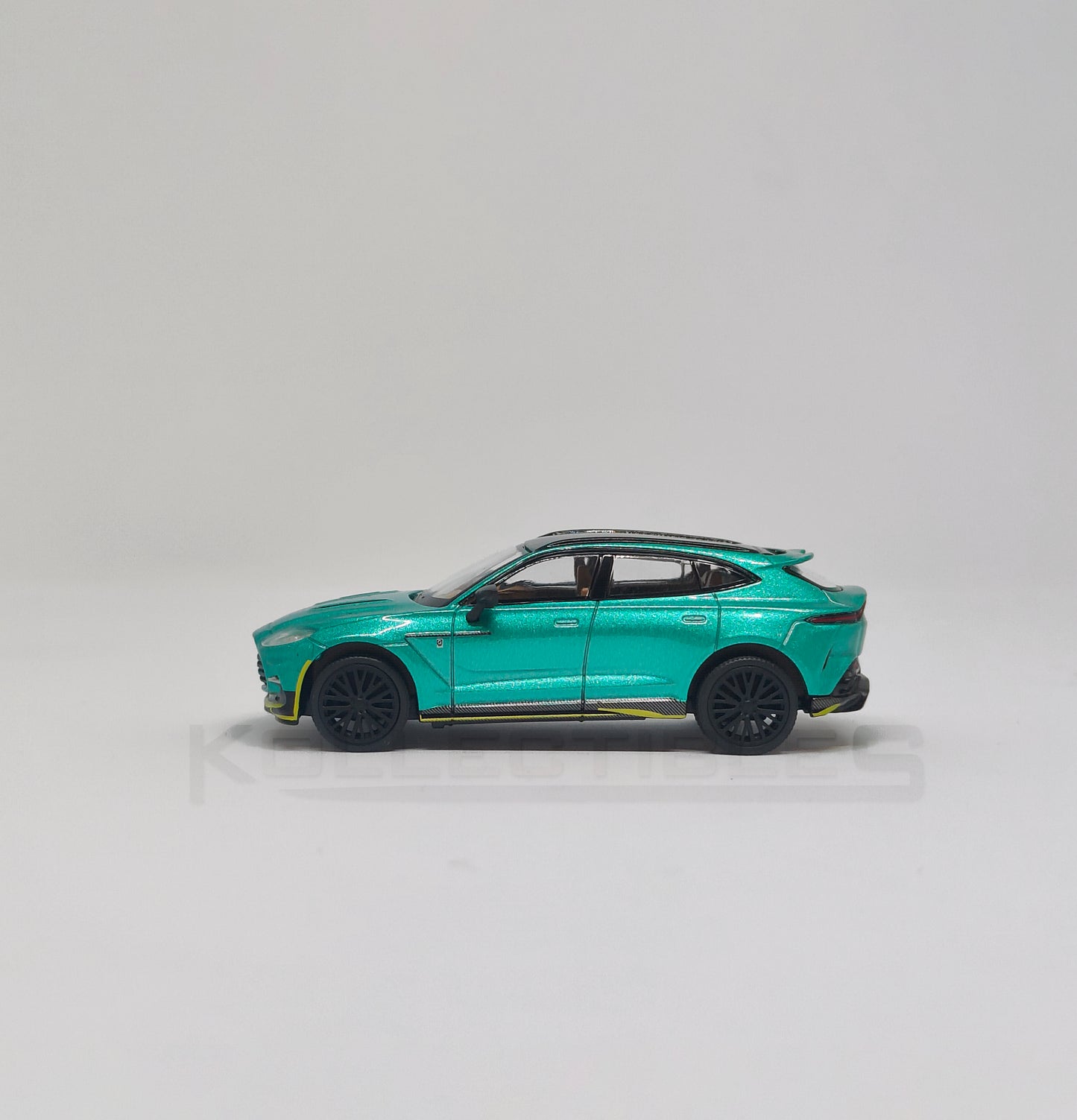 Side 1 view of Aston martin DBX Green 1:64 scale model car - Xcartoys x Poprace