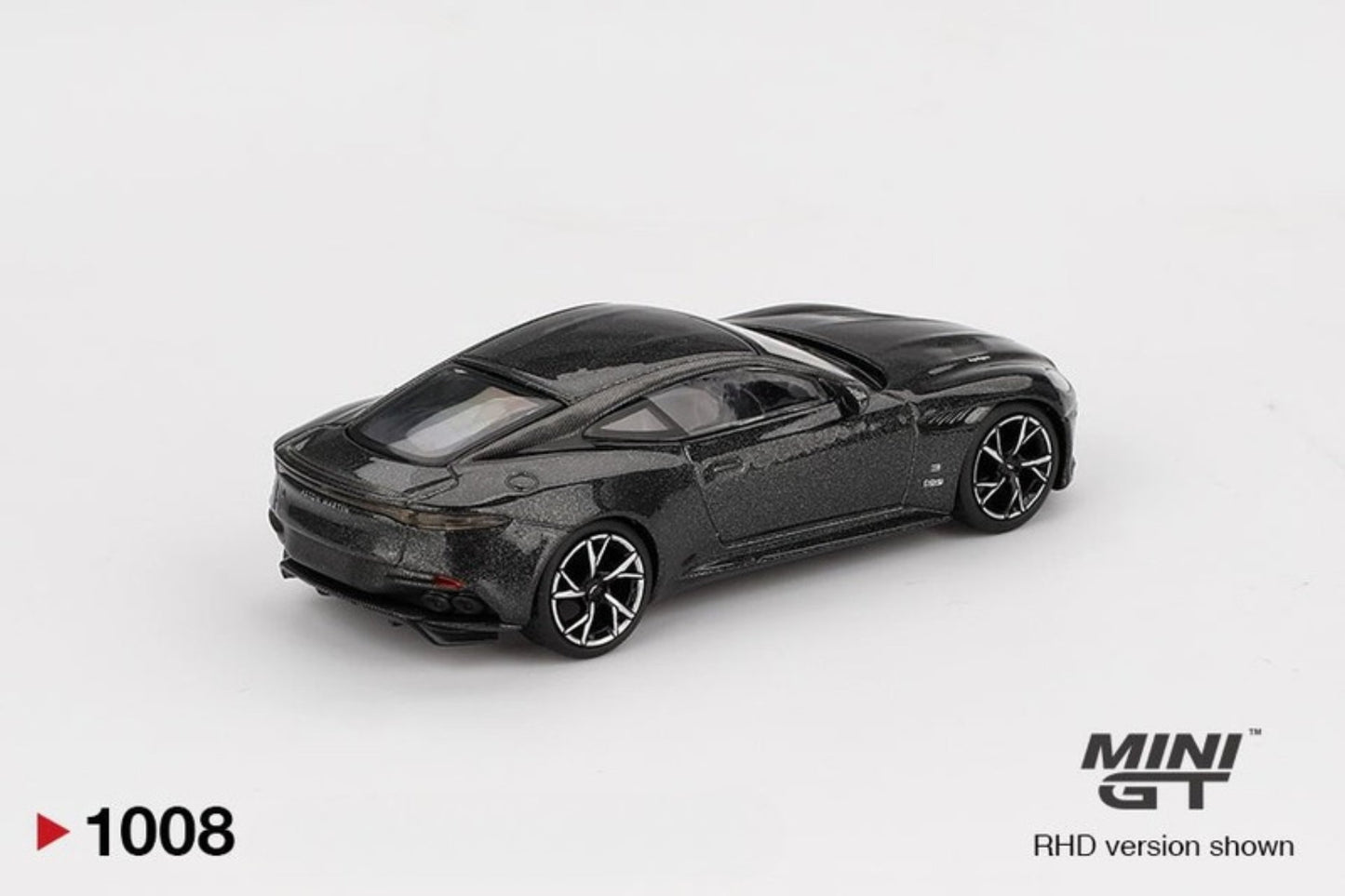 Model Aston Martin DBS 007 car of a black sports car on a white background with 'MINI GT' branding.