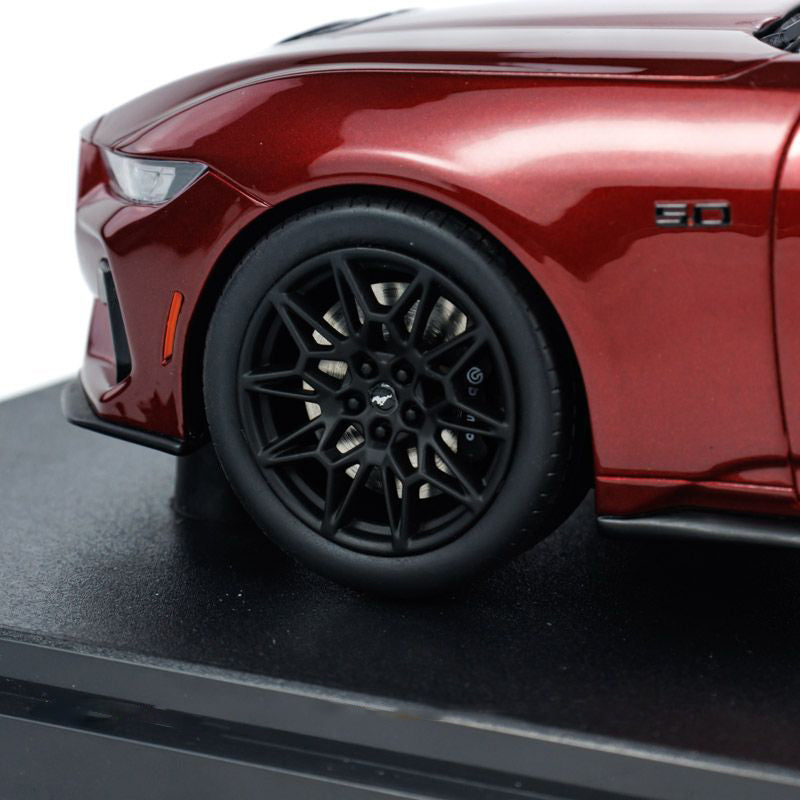 closeup view of Wheels and tyre of Ford Mustang GT 2024 Rapid RED 1:18 scale model car -GT Spirit