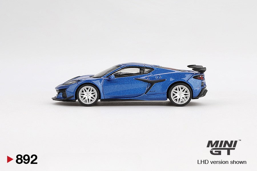 Side view of Chevrolet Corvette Z06 2023 Elkhart Lake Blue Metallic 1:64 scale model car by Mini GT
