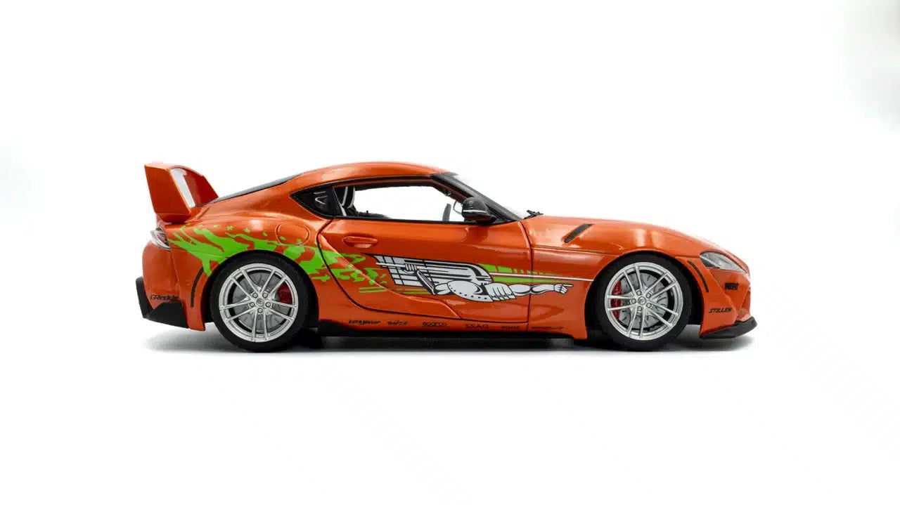 Side view of Toyota GR Supra Fast & Furious Tribute Orange 2024 1:18 scale model car - Solido