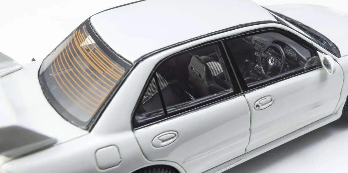 top perspective view of both the back and the side Kyosho 1:43  Mitsubishi Lancer Evolution III white