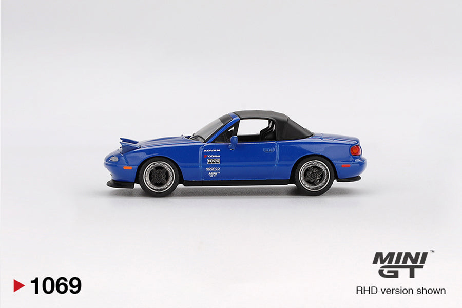 Side view of Mazda Miata MX-5 (NA) Tuned Version Dark Blue 1:64 scale model car - Mini GT