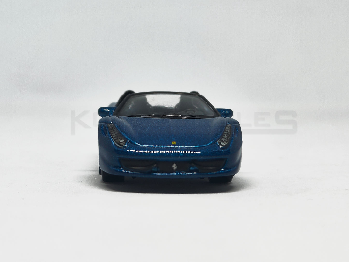 Front view of Ferrari 458 Spider Blue 1:64 scale model car - Bburago