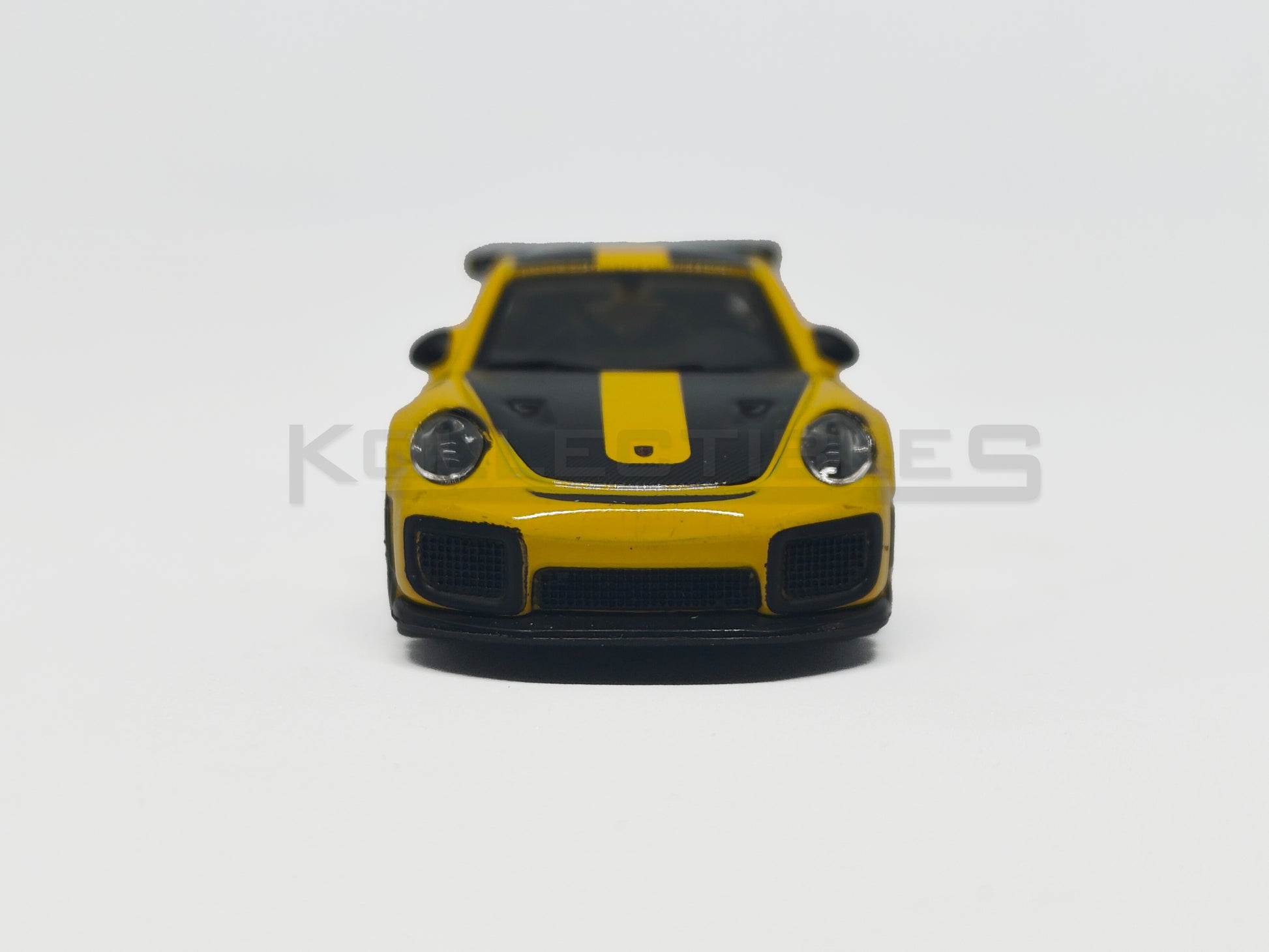front view of Porsche GT2 RS Yellow 1:64 scale model car - Bburago