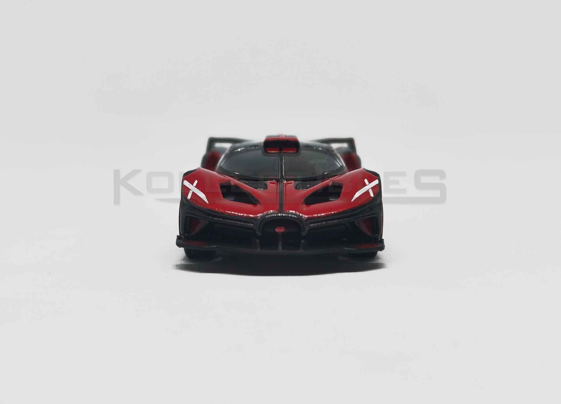 Front view of Bugatti Bolide red and Black 1:64 scale model car - Bburago
