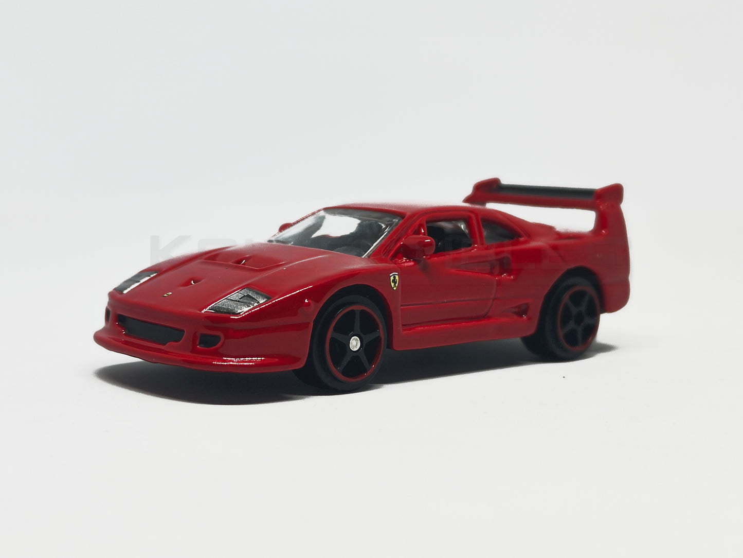Front perspective view of Ferrari F40 Competizione Red 1:64 scale model car - Bburago