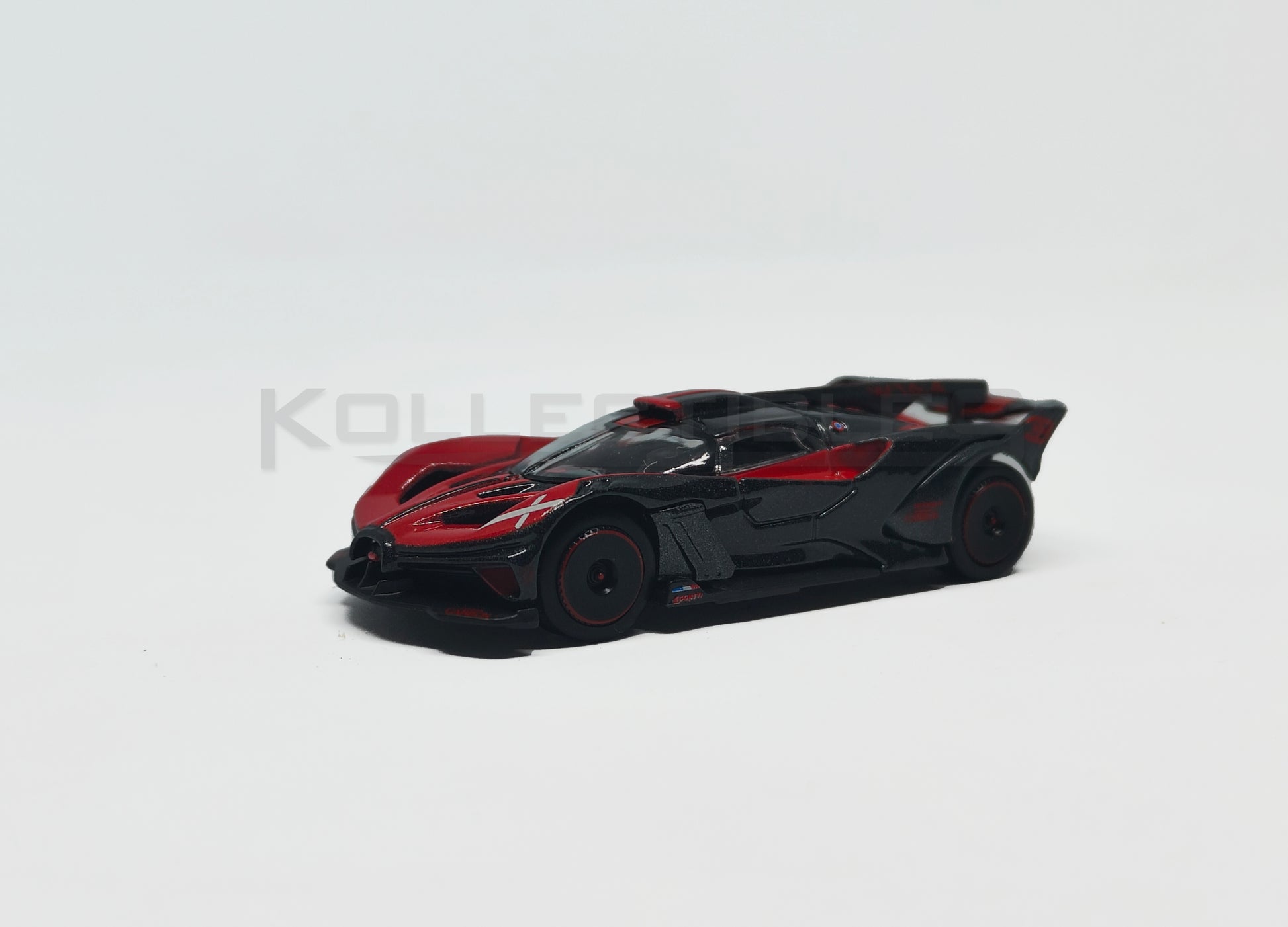 Front perspective of Bugatti Bolide red and Black 1:64 scale model car - Bburago