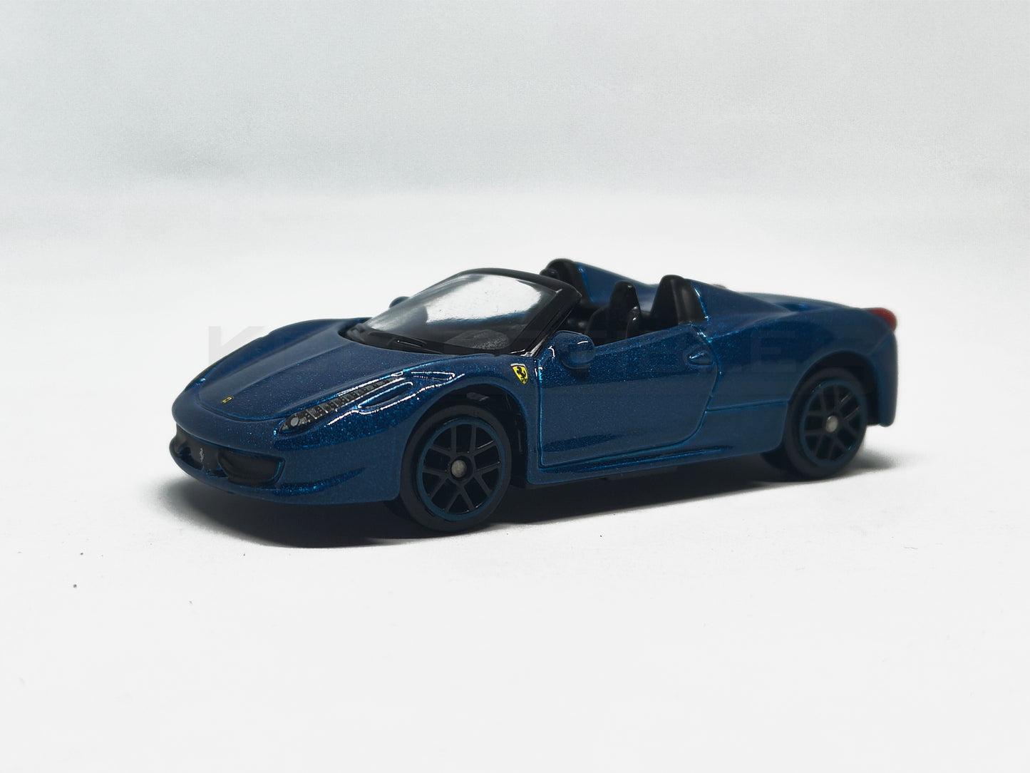 Front perspective of Ferrari 458 Spider Blue 1:64 scale model car - Bburago
