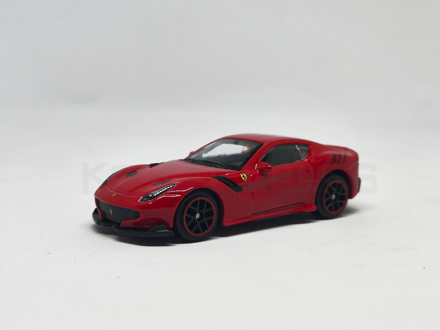front perspective view of F12DTF Red 1:64 scale model car 1:64 scale model car - Bburago