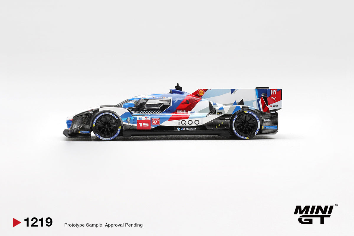 Mini GT BMW M Hybrid V8 Hypercar #15 white and blue 1:64 scale diecast model car, side profile showing the #15 number board and geometric BMW M livery