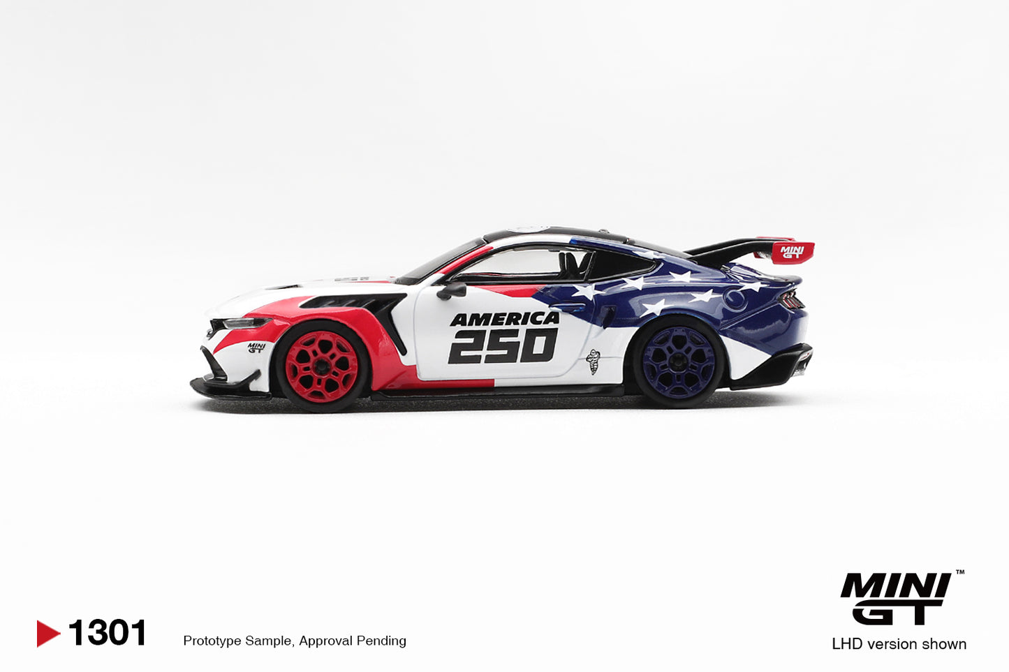 Mini GT Ford Mustang GTD America 250 USA Exclusive white red blue 1:64 scale diecast model car, side profile showing the AMERICA 250 door graphics and blue rear wheels