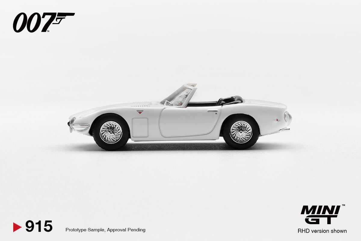 Mini GT Toyota 2000GT Roadster You Only Live Twice 007 white 1:64 scale diecast model car, side profile showing the chrome wire-spoke wheels and slim chrome side trim