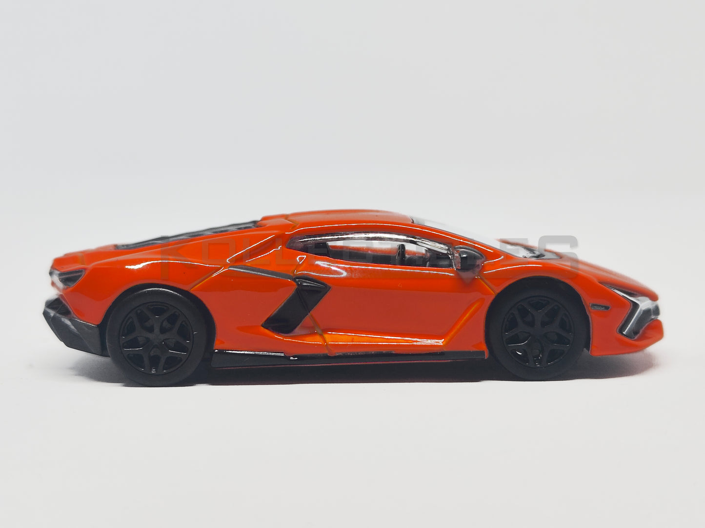 side2 of Lamborghini Revuelto Orange 1:64 scale model car - Bburago