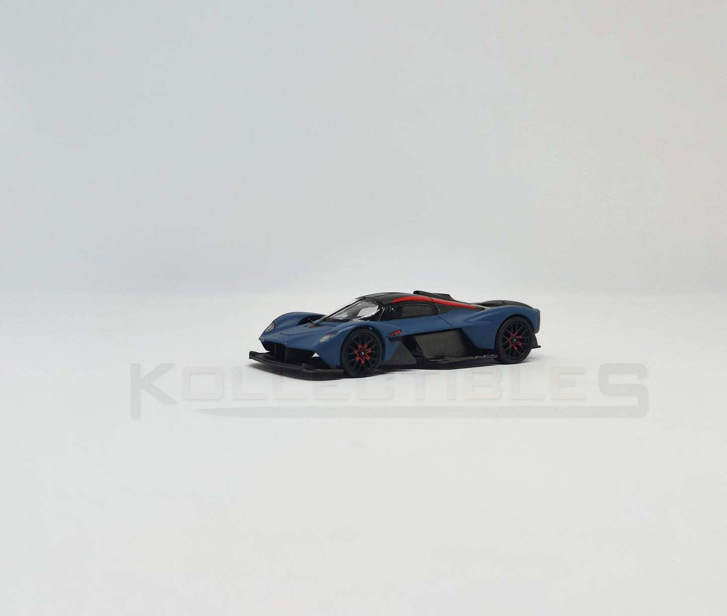 Perspective view of Aston Martin Valkyire Satin Marina Blue 1:64 scale model car- Xcartoys x Poprace