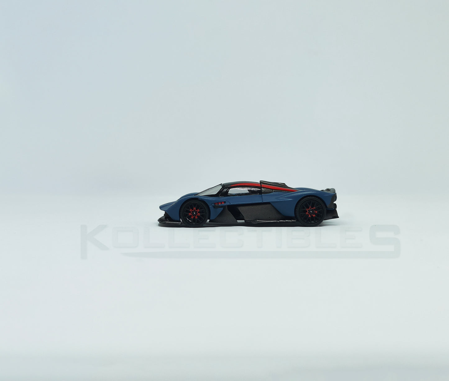 Side view of Aston Martin Valkyire Satin Marina Blue 1:64 scale model car- Xcartoys x Poprace
