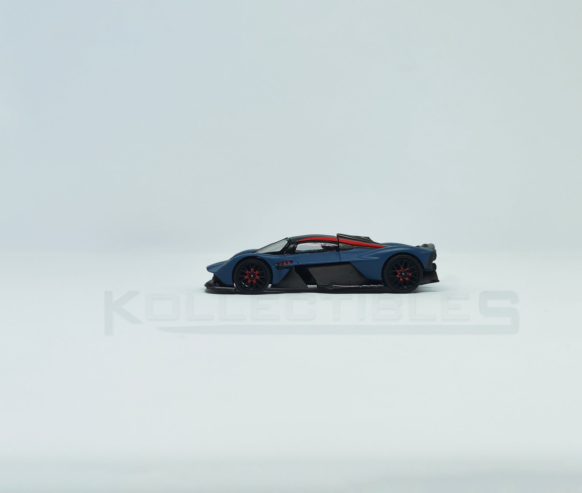 Side view of Aston Martin Valkyire Satin Marina Blue 1:64 scale model car- Xcartoys x Poprace