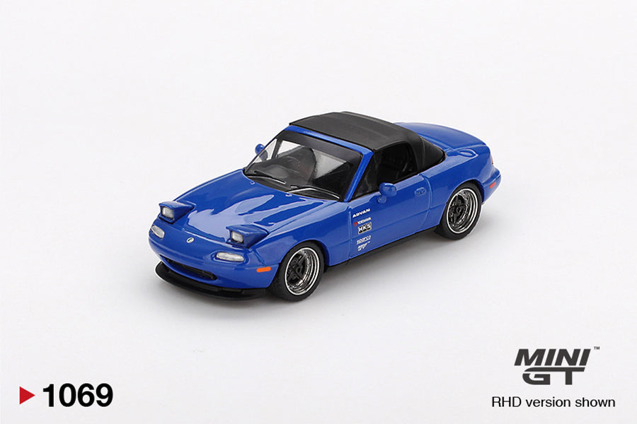 Front perspective view of Mazda Miata MX-5 (NA) Tuned Version Dark Blue 1:64 scale model car - Mini GT