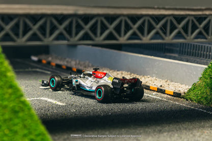 Model racing car on a miniature track with a blurred background