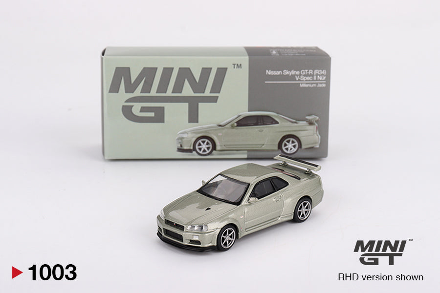 Box of Nissan Skyline GT-R (R34) V-Spec II Nür Millenium Jade 1:64 scale model car - Mini GT
