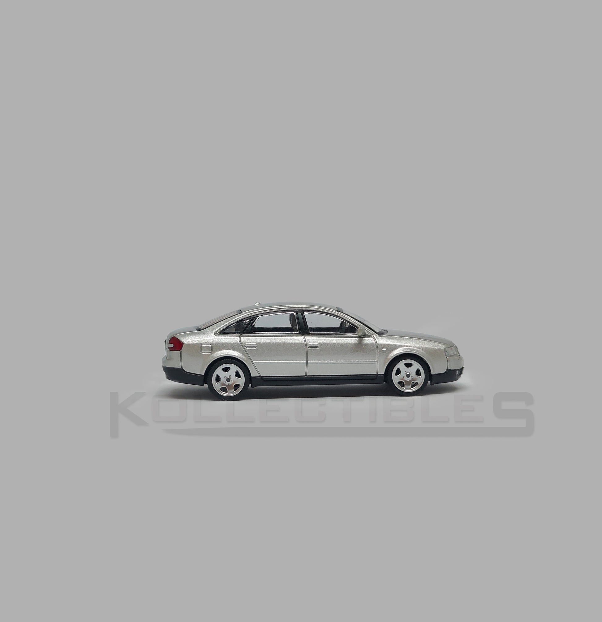 Side 2 view of Audi A6 second generation (C5) metallic silver 1:64 scale model car - Xcartoys x Poprace