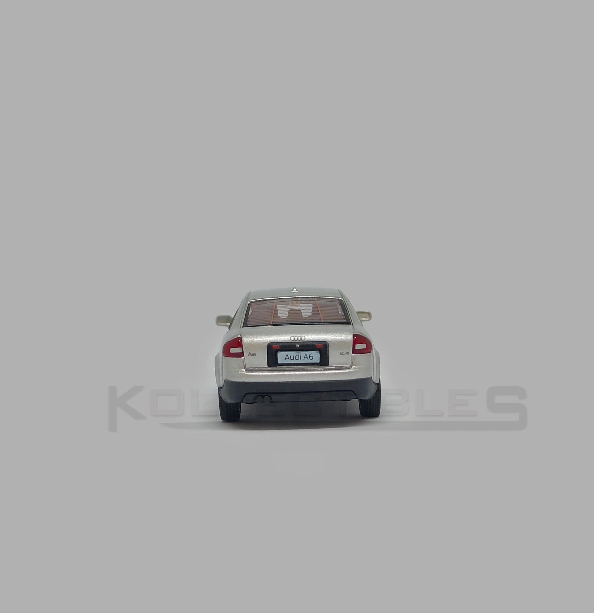 Back view of Audi A6 second generation (C5) metallic silver 1:64 scale model car - Xcartoys x Poprace