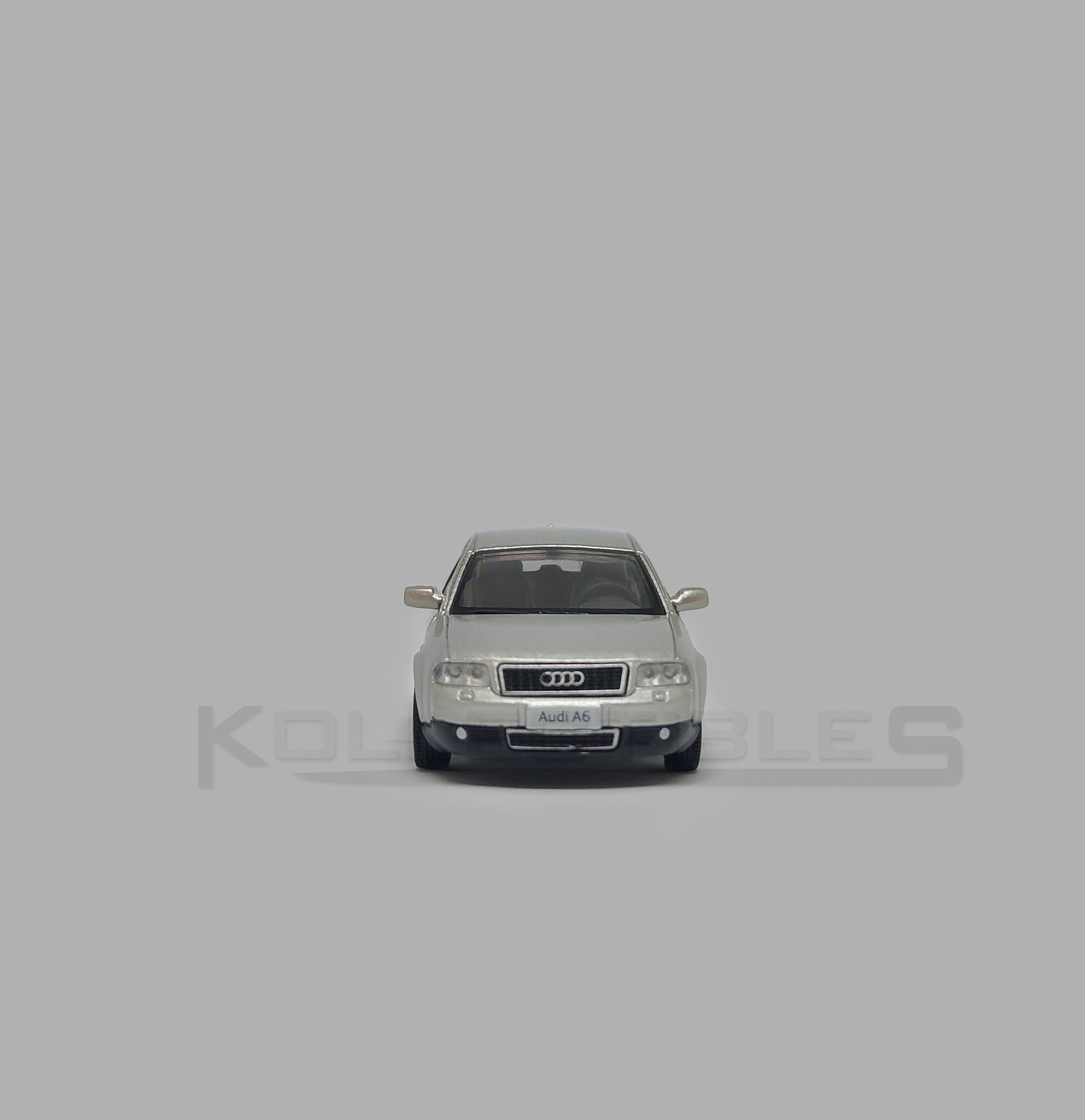 Front view of Audi A6 second generation (C5) metallic silver 1:64 scale model car - Xcartoys x Poprace