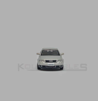 Front view of Audi A6 second generation (C5) metallic silver 1:64 scale model car - Xcartoys x Poprace