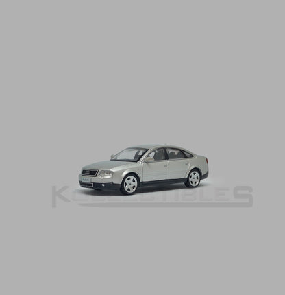 Perspective view of Audi A6 second generation (C5) metallic silver 1:64 scale model car - Xcartoys x Poprace