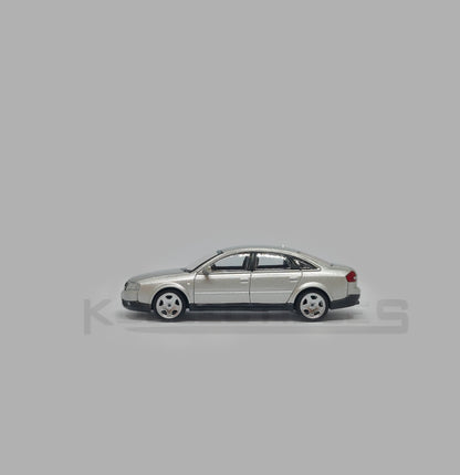 Side 1 view of Audi A6 second generation (C5) metallic silver 1:64 scale model car - Xcartoys x Poprace