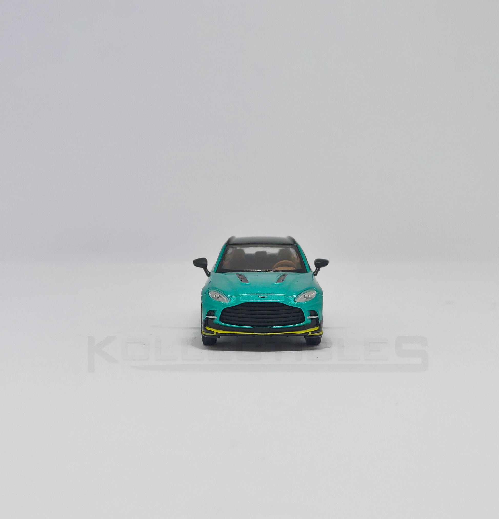 Front view of Aston martin DBX Green 1:64 scale model car - Xcartoys x Poprace