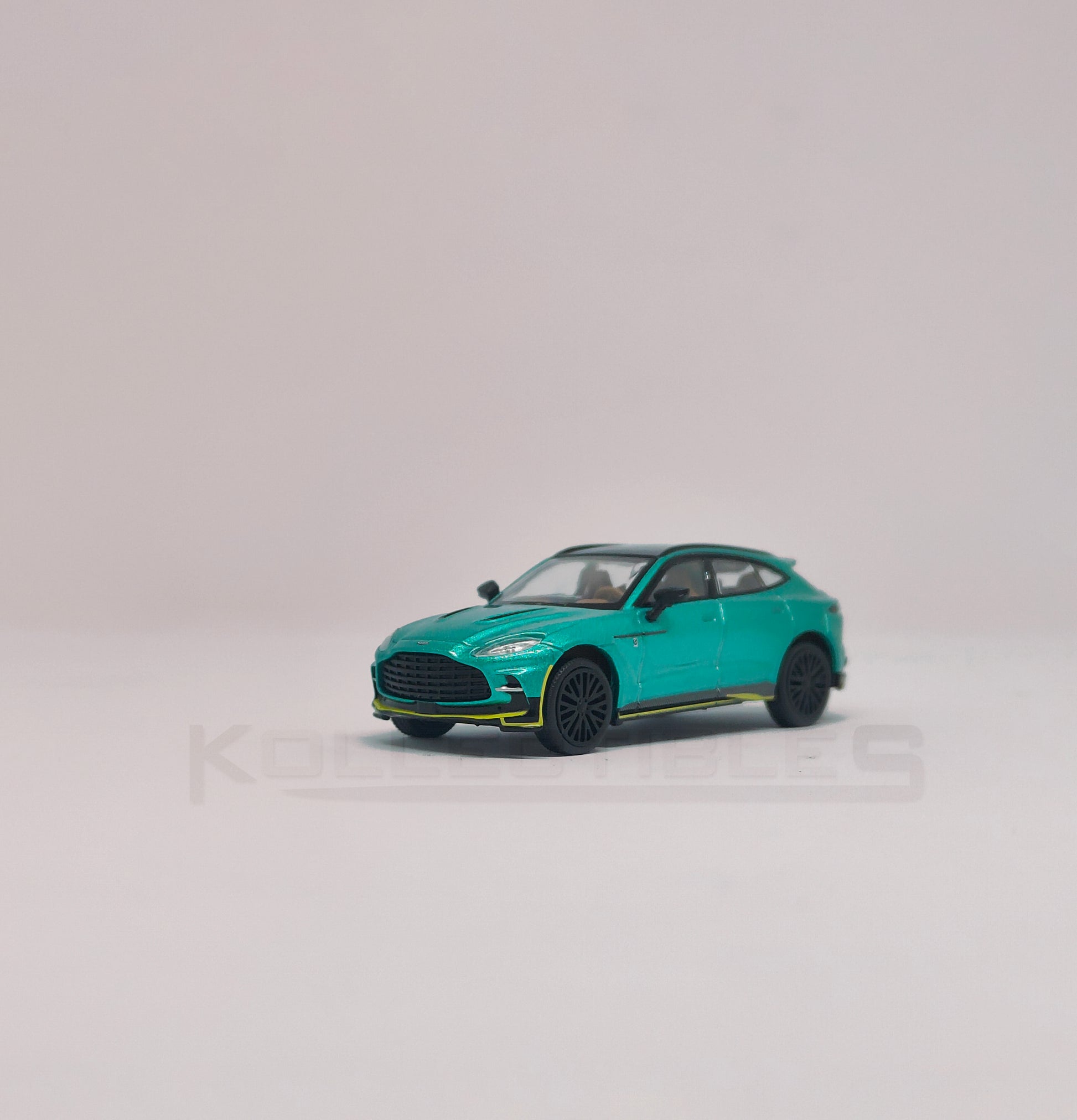 Perspective view of Aston martin DBX Green 1:64 scale model car - Xcartoys x Poprace