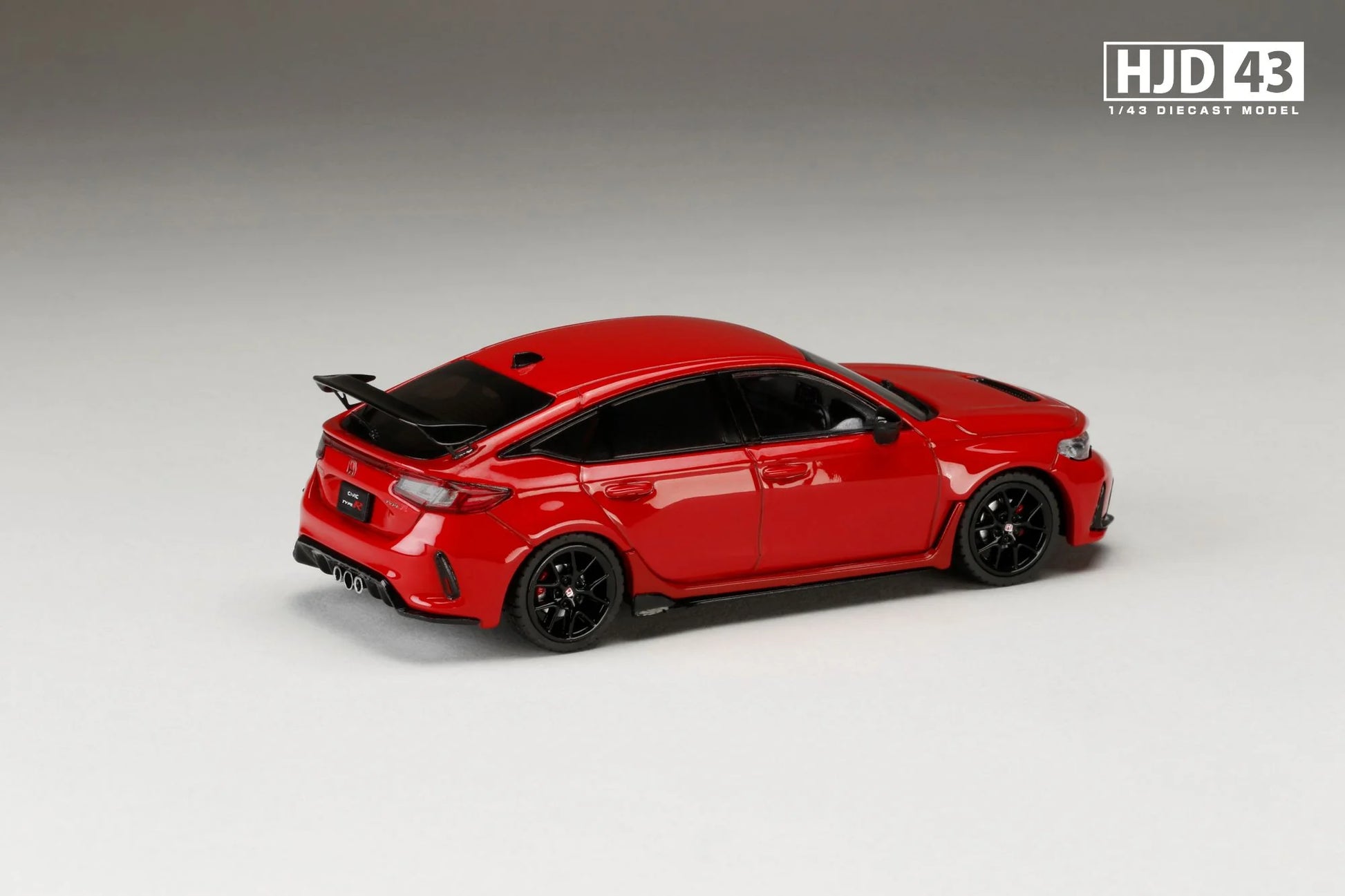 Red model car on a gray background with 'HJD43' branding.
