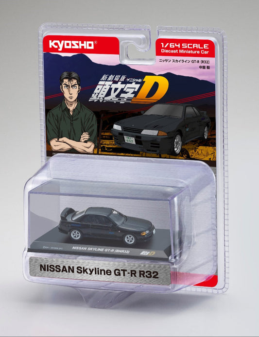 A diecast model of a Nissan Skyline GT-R (BNR32) from the Initial D anime series, packaged in a clear plastic case with a display stand.