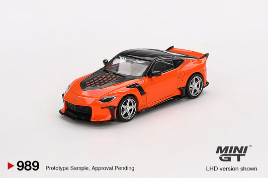 Orange and black model car on a white background with 'MINI GT' branding.