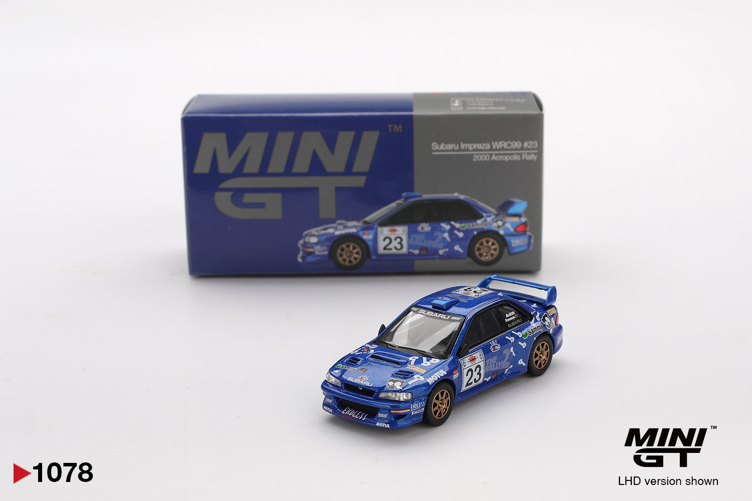 Miniature model car with camouflage design and 'MINI GT' branding on a white background