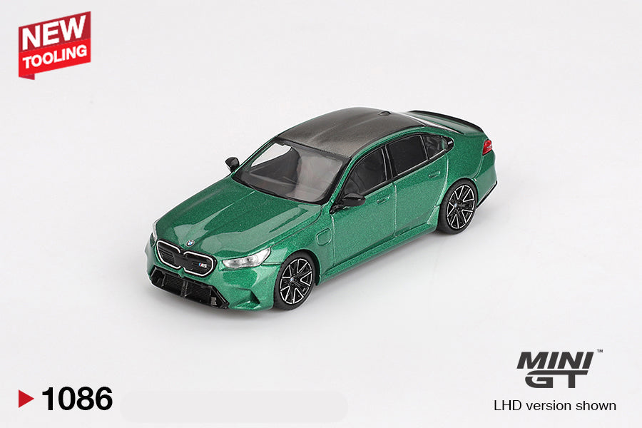 Front perspective view of BMW M5 Isle of Man Green Metallic 1:64 scale model car - Mini GT