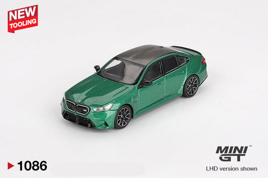 Front perspective view of BMW M5 Isle of Man Green Metallic 1:64 scale model car - Mini GT