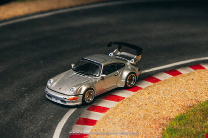 Porsche RWB 964 Silver 1:64 Scale Model Car – Tarmac Works (Product Code: T64-037-SL) in a race track diorama