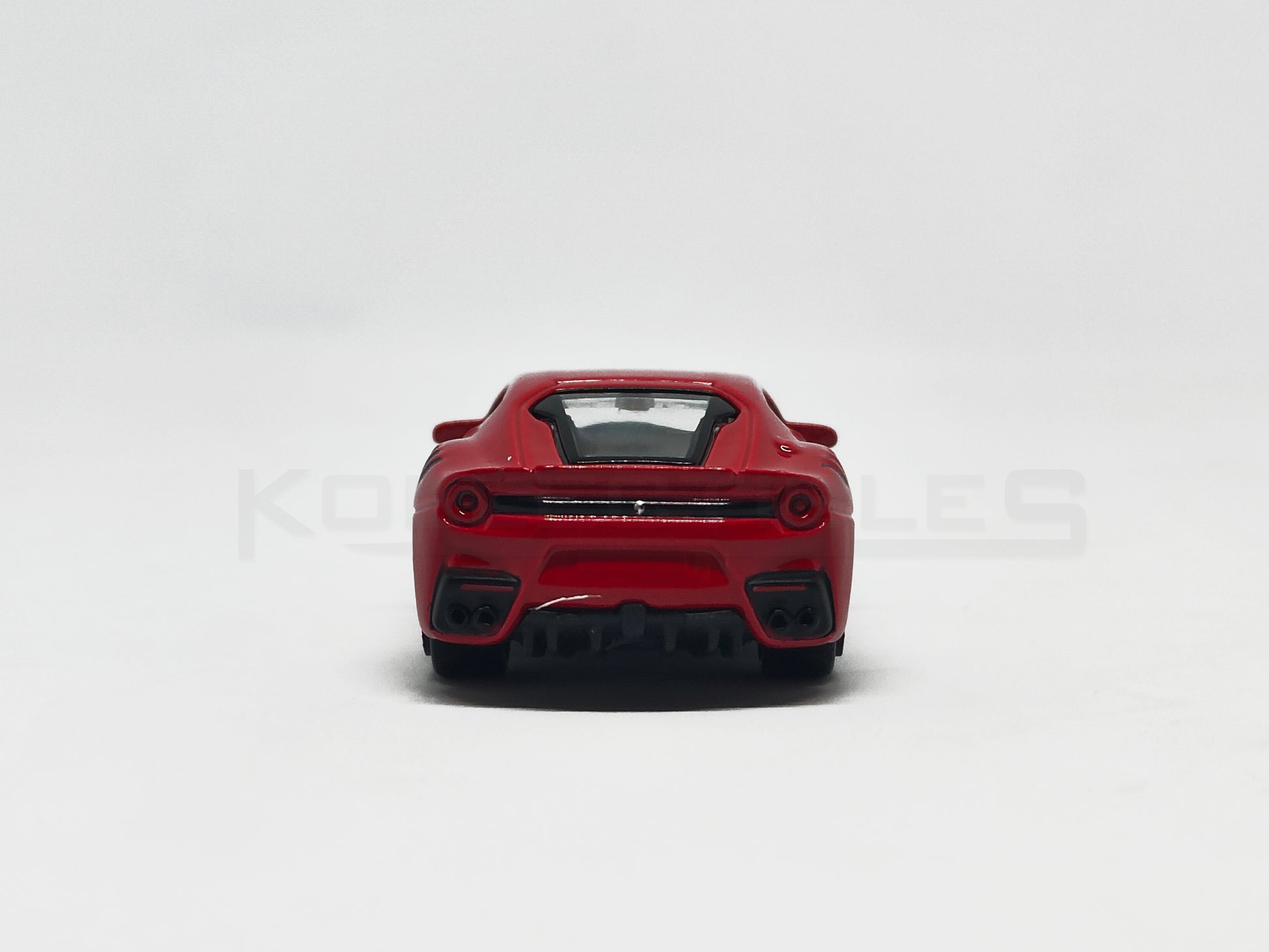 Back view of F12DTF Red 1:64 scale model car 1:64 scale model car - Bburago