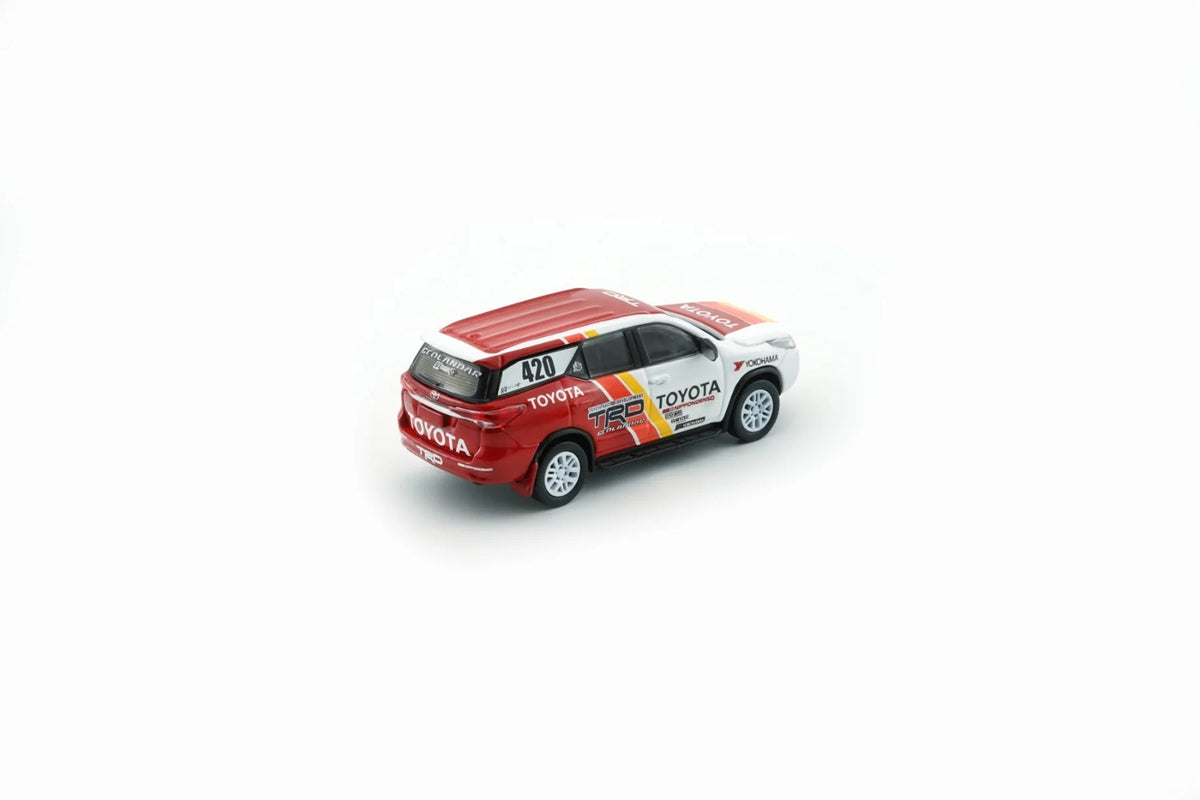 Rear three-quarter view of Toyota Fortuner 2018 TRD Racing 1:64 diecast showing the roof spoiler and TRD tailgate branding (64B0474)