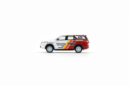 Side view of Toyota Fortuner 2018 TRD Racing 1:64 scale model car showing the yellow and red TRD stripes and white rally wheels (64B0474)