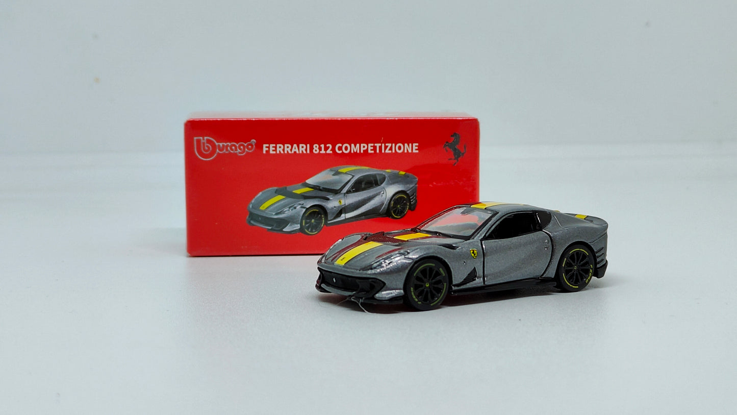 Ferrari model car with red box packaging on a white background