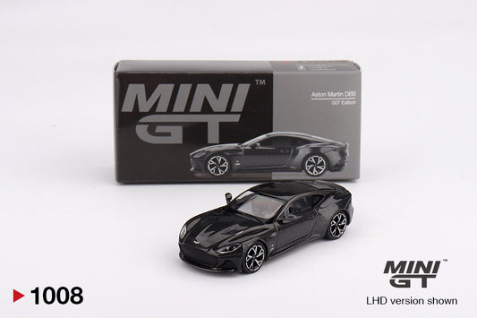 Black model  Aston Martin DBS car in front of its packaging with 'MINI GT' branding on a white background.