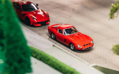 Front three-quarter view of Ferrari 250 GTO 1962 red 1:64 diecast model car by Centauria x IXO Collections showing the louvred bonnet and three nostril vents (IXC.FSD.FE.006-E)