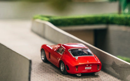 Rear three-quarter view of Ferrari 250 GTO 1962 1:64 diecast showing the Kamm tail, integrated spoiler and twin exhausts (IXC.FSD.FE.006-E)